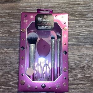 Makeup brushes, sponge, and hair clips